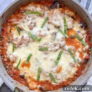 A large skillet with eggplant parmesan casserole