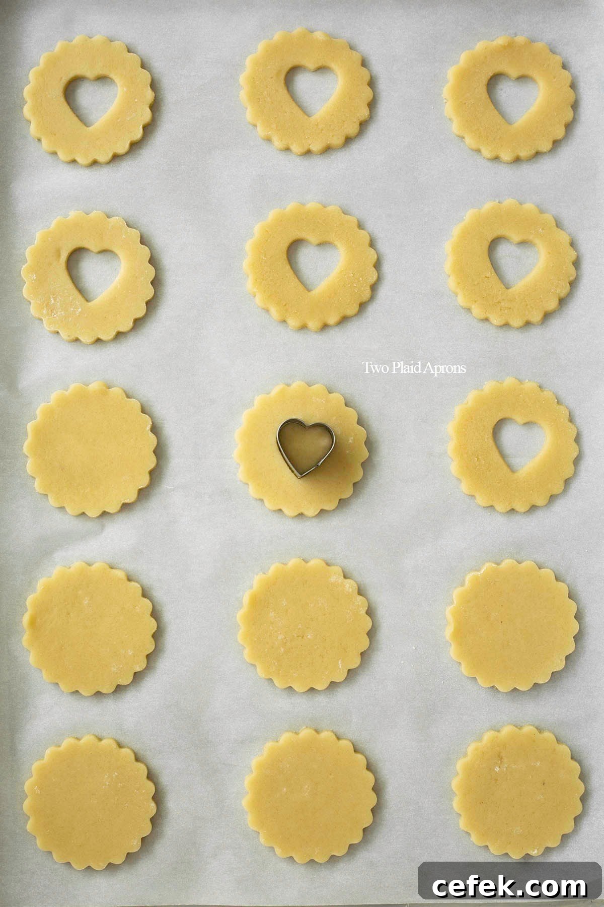 Cutting out heart "windows" on Linzer cookies.