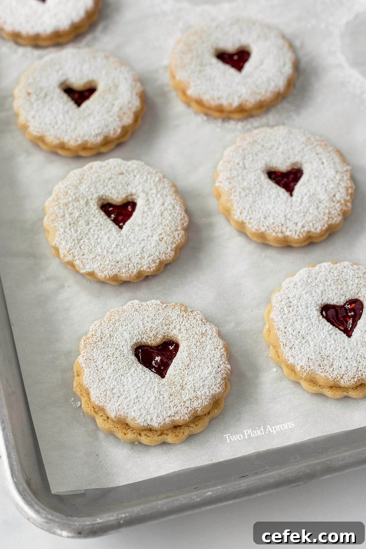 Angled view of a tray of Linzer cookies assembled.