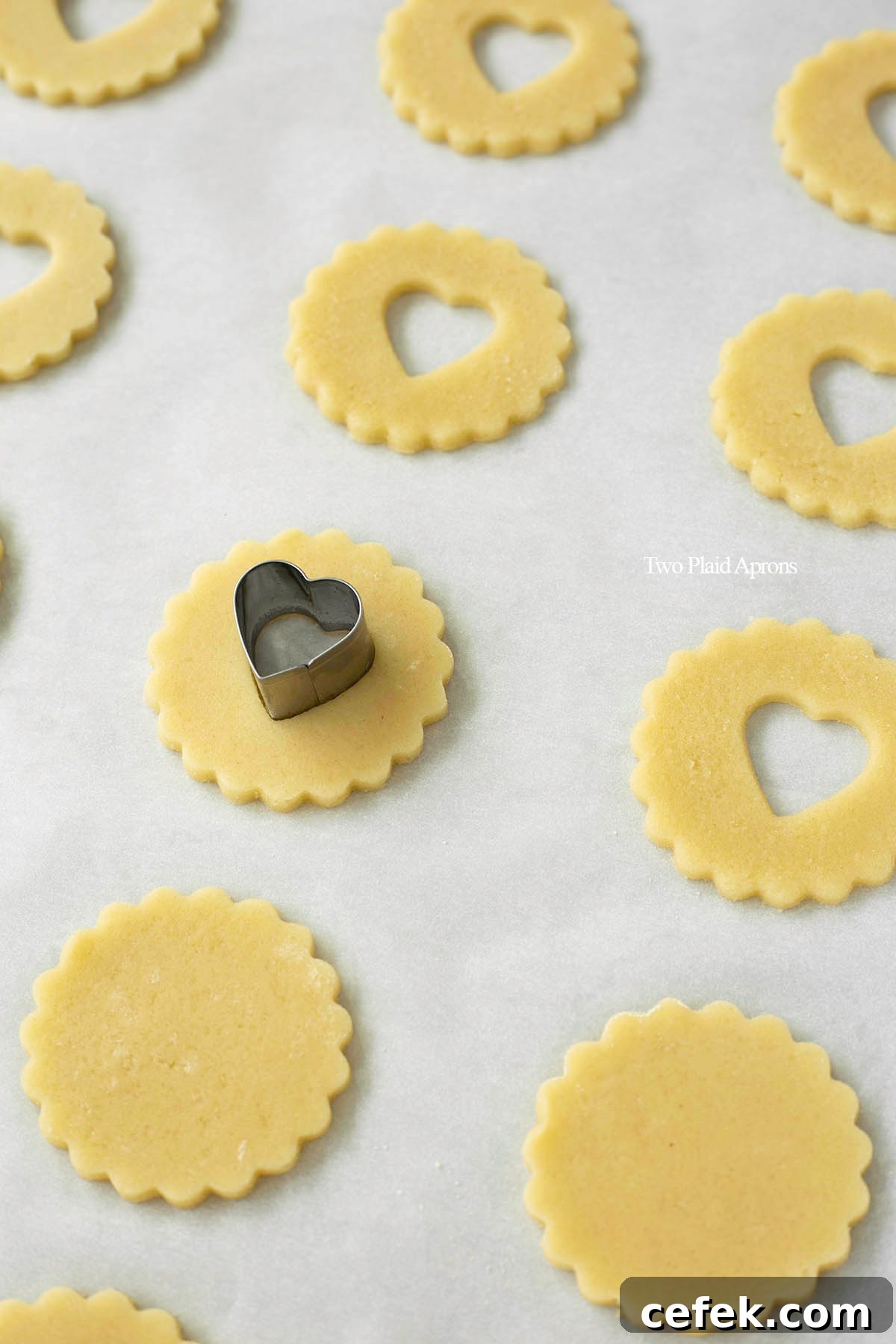 Using a mini cookie cutting to make heart "windows".