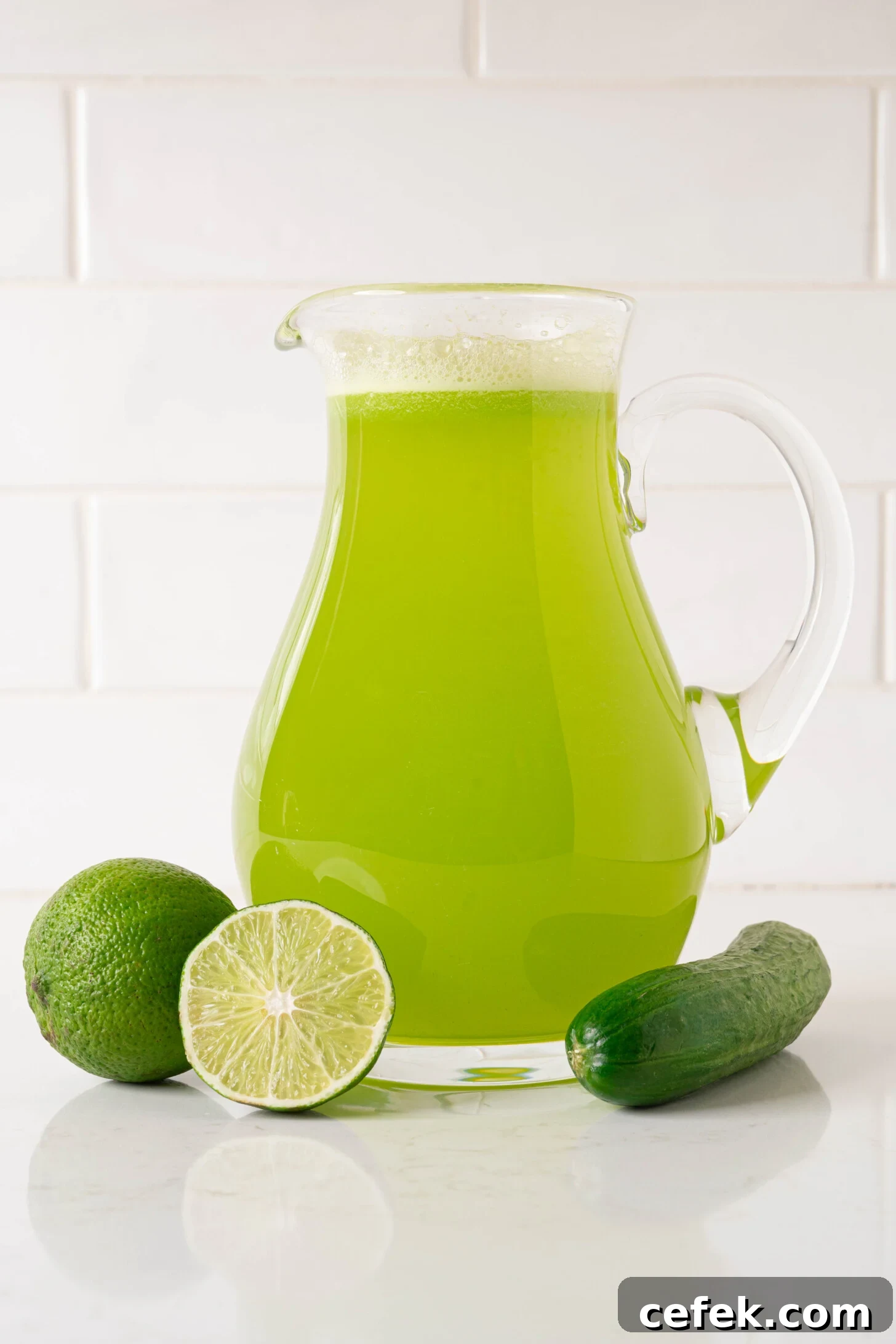 A pitcher of agua de pepino con limon.