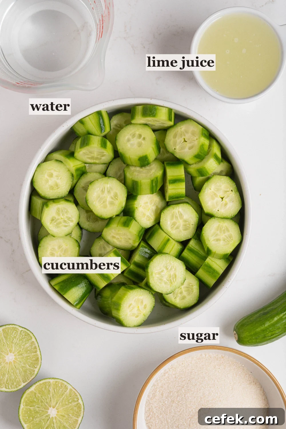 Bowls of chopped cucumbers, lime juice, sugar, and more.