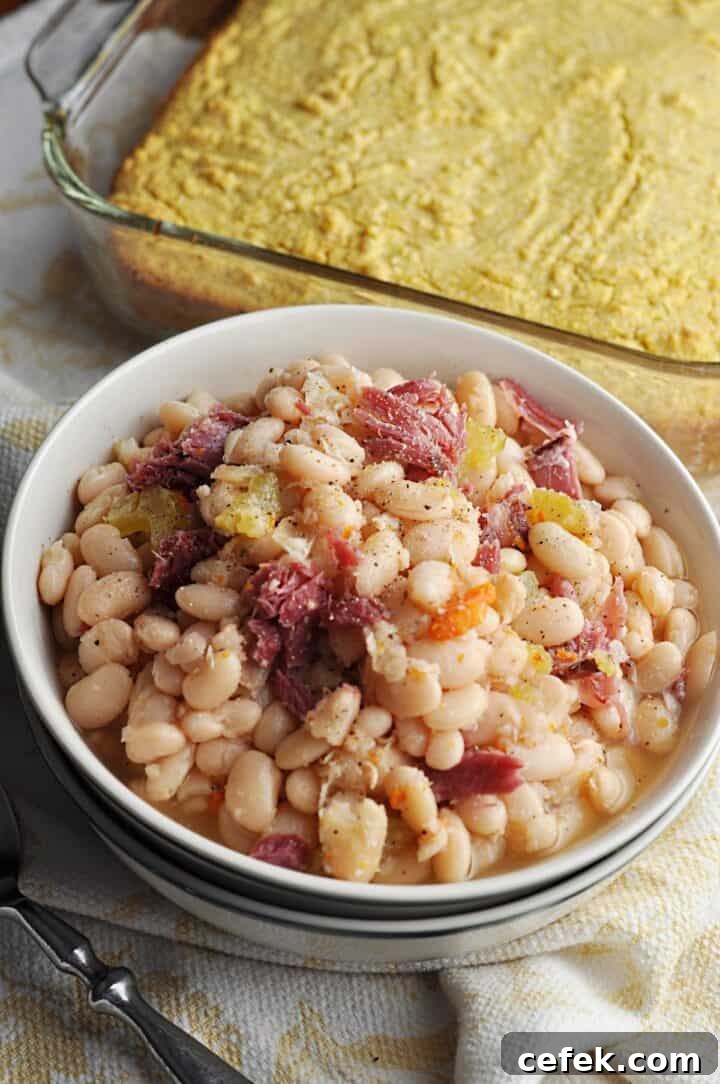 White beans in a bowl served with corn bread