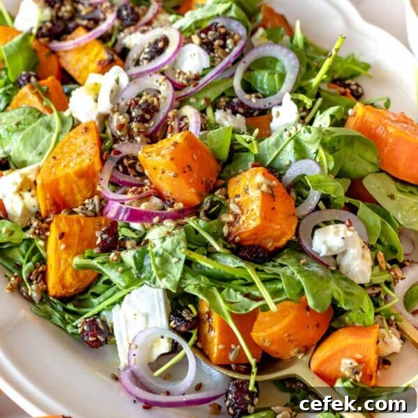 sweet potato salad with arugula and feta on a platter