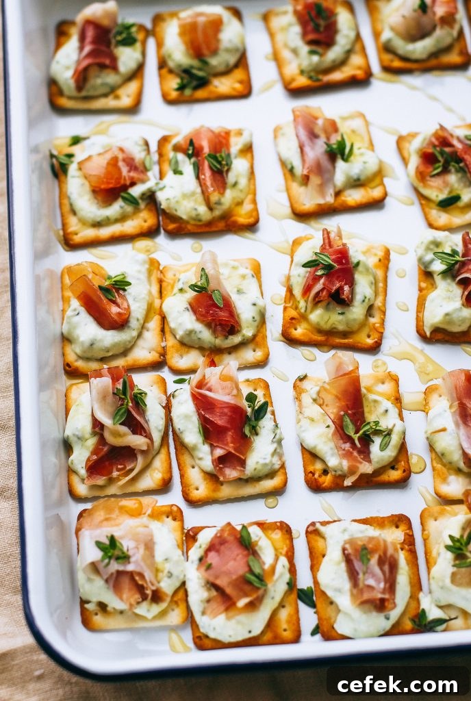 prosciutto and ricotta on crackers with honey drizzle on white tray