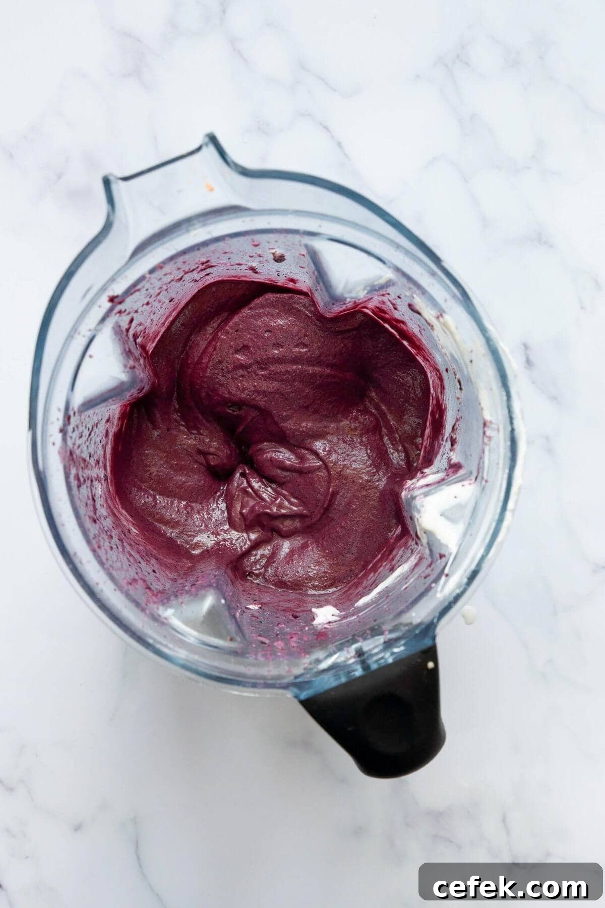 Blended high protein acai bowl base in a Vitamix blender showing thick, creamy soft-serve texture.