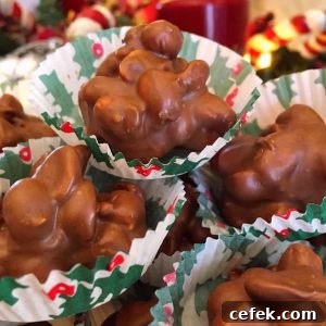 Crock pot peanut clusters in candy wrappers stacked high.