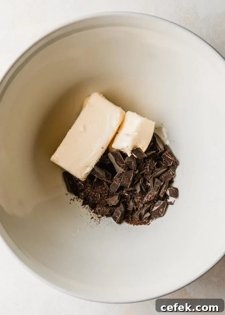 A white bowl of butter and chopped chocolate.