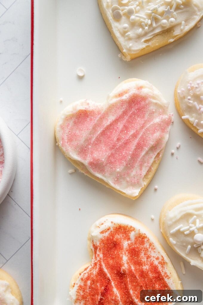 Close up of spreadable cream cheese frosting spread on a sugar cookie to show a light crust on top.
