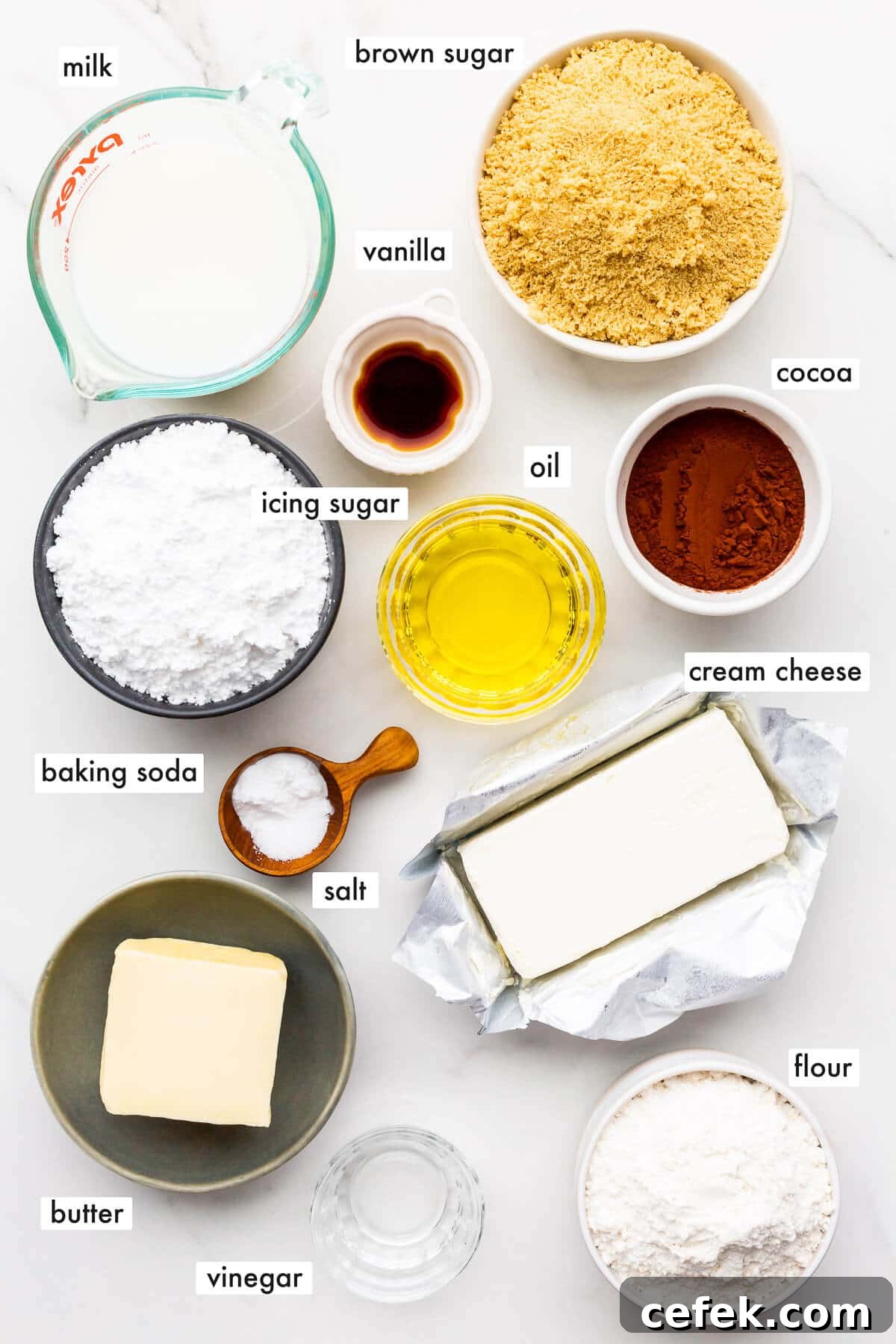 Ingredients to make an eggless chocolate cake with cream cheese frosting.