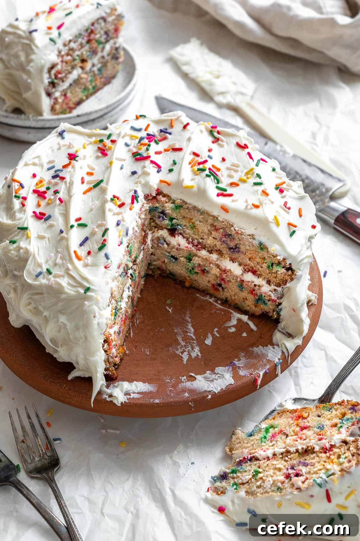 completed vegan birthday cake on a white surface