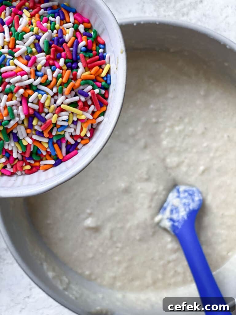 process shot of adding sprinkles to batter