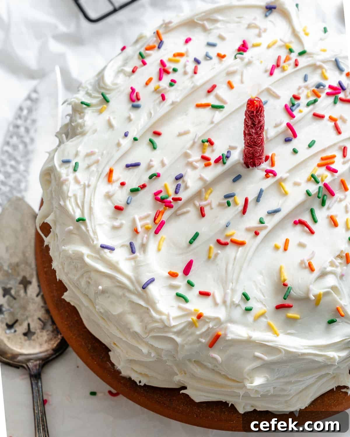 completed vegan birthday cake on a white surface