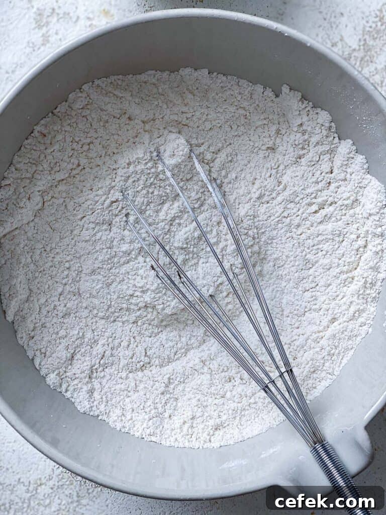 process shot of whisking ingredients together in bowl