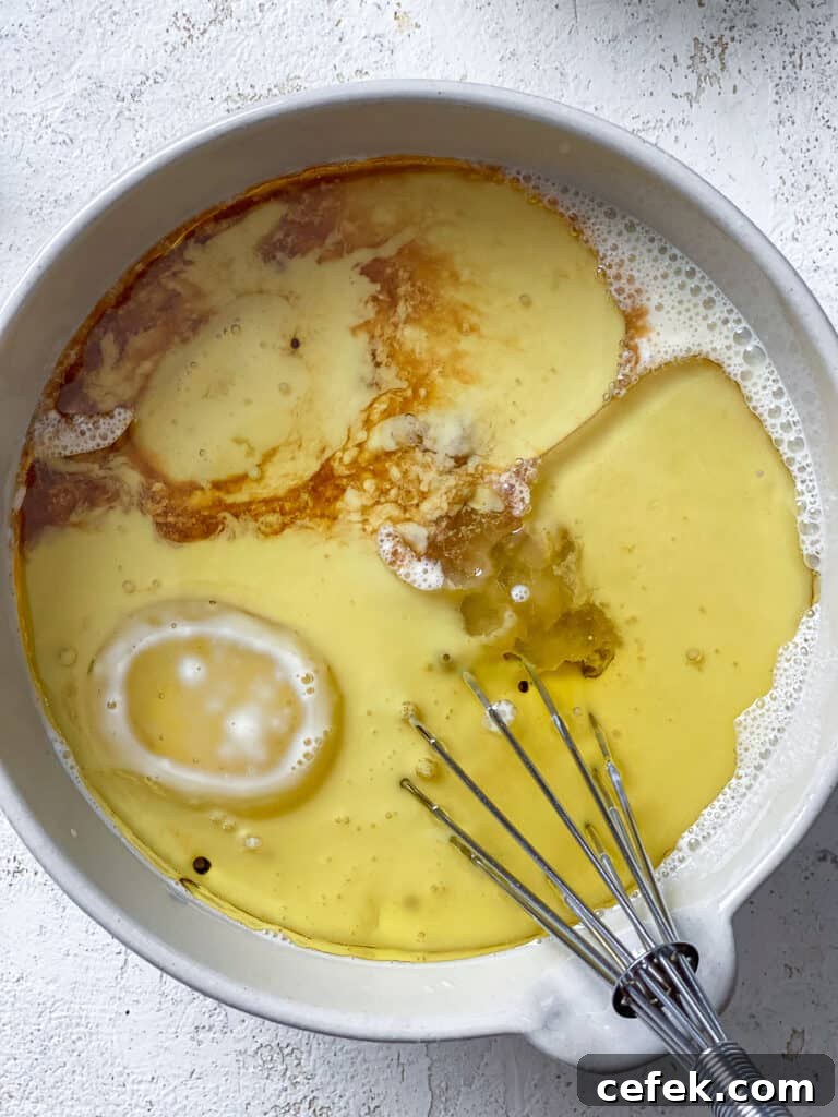 process shot of whisking ingredients together in bowl