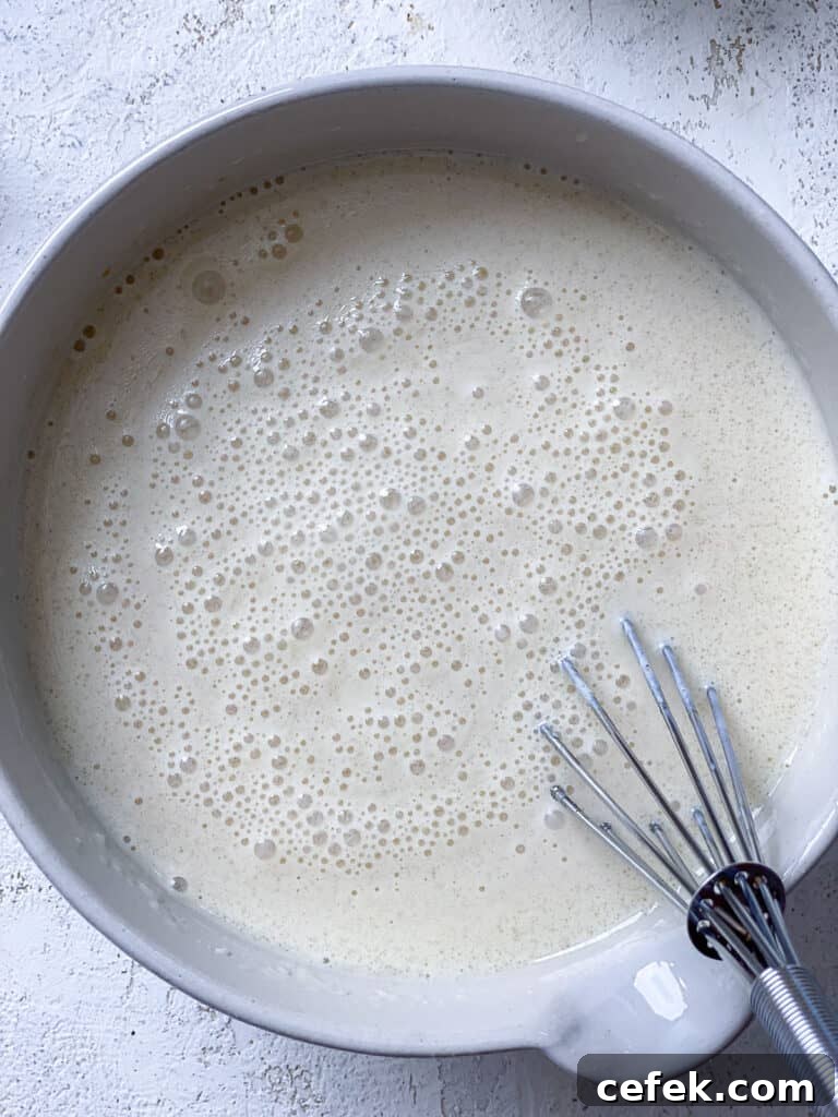 process shot of whisking ingredients together in bowl