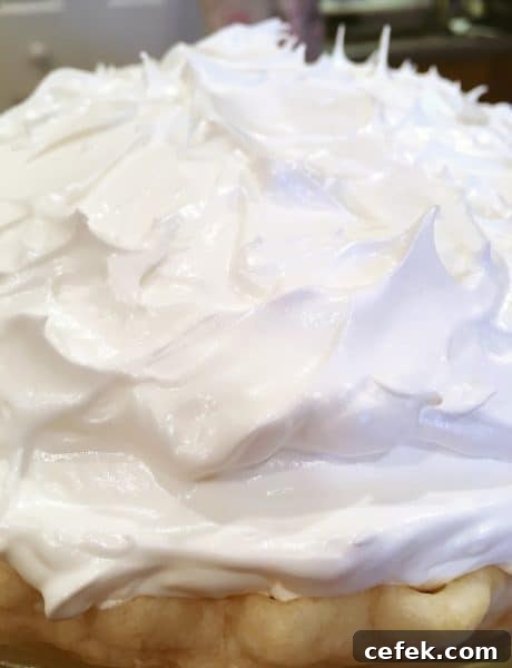 Meringue topping on top of the pie ready for the oven
