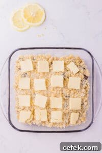 thin slices of butter on top of cobbler mixture.