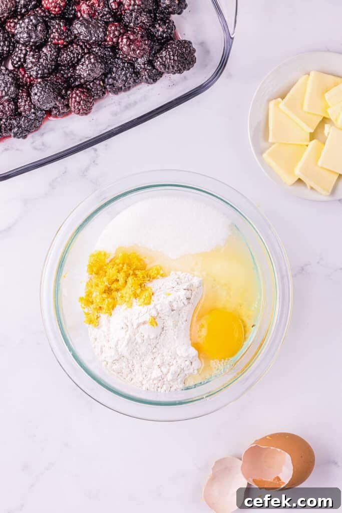 mixing topping ingredients for blackberry cobbler recipe.