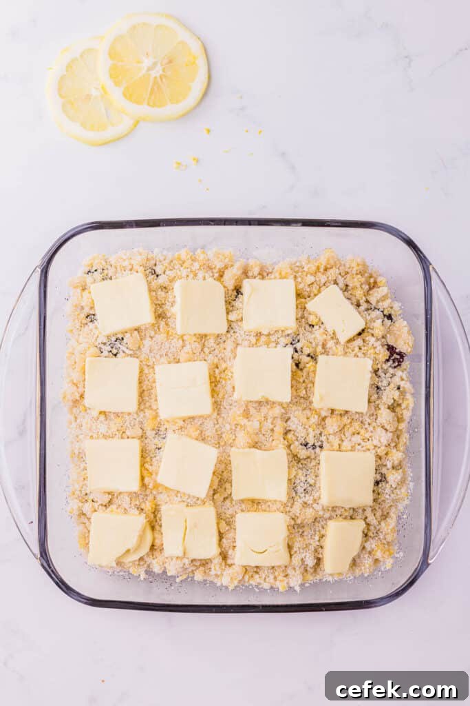 thin slices of butter on top of cobbler mixture.