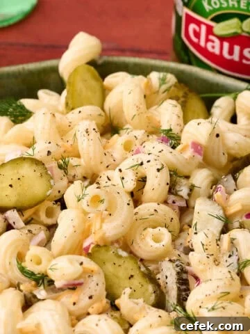 Chopped pickles are added to the top of the dill pickle pasta salad.
