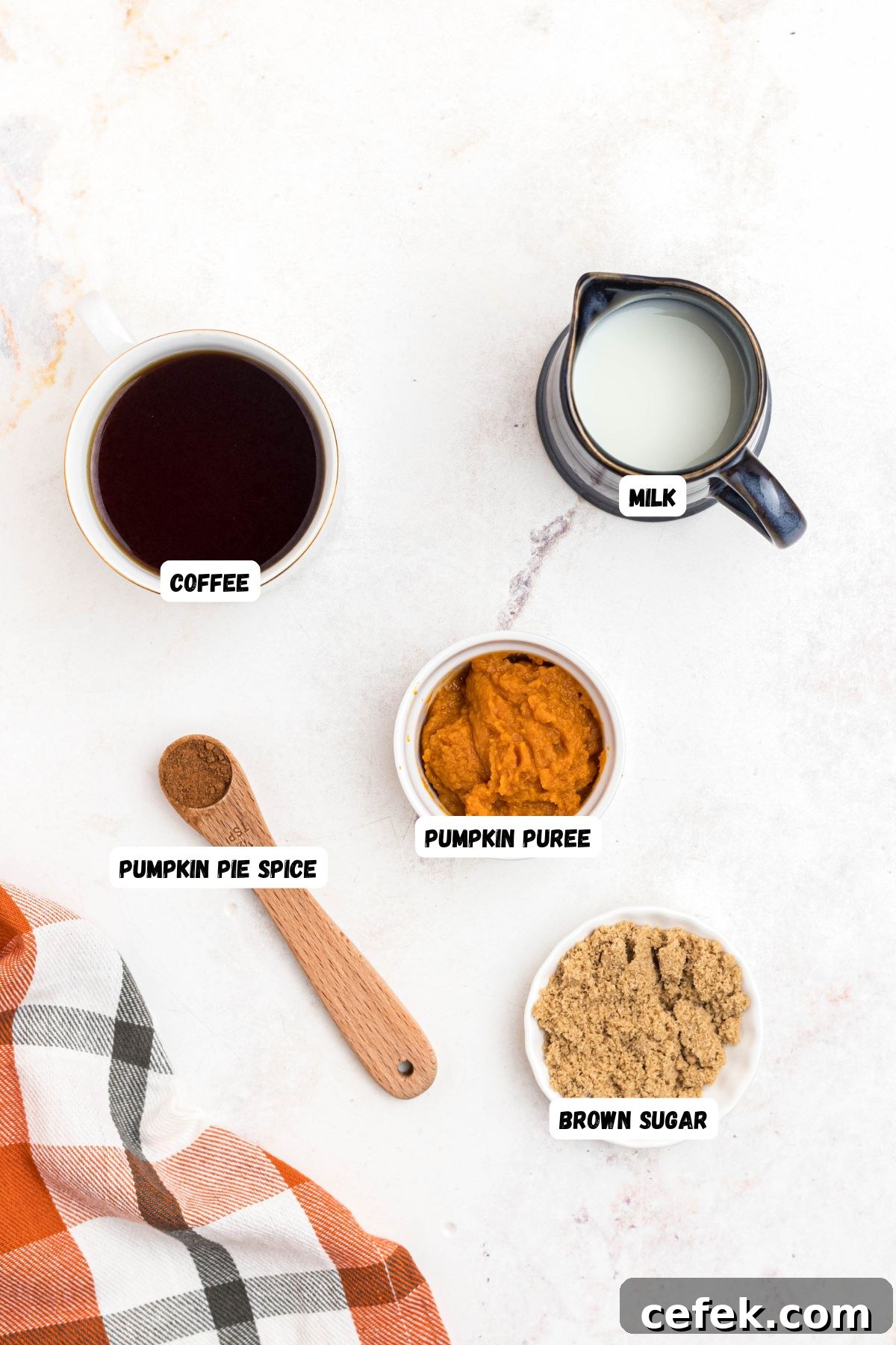 Ingredients you will need to make pumpkin coffee measured into small bowls and labeled, 