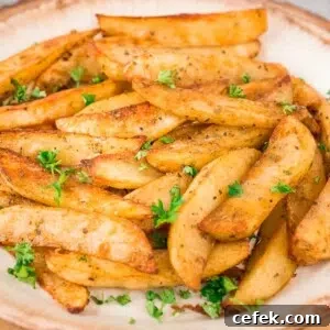 close up of baked potato wedges on a plate