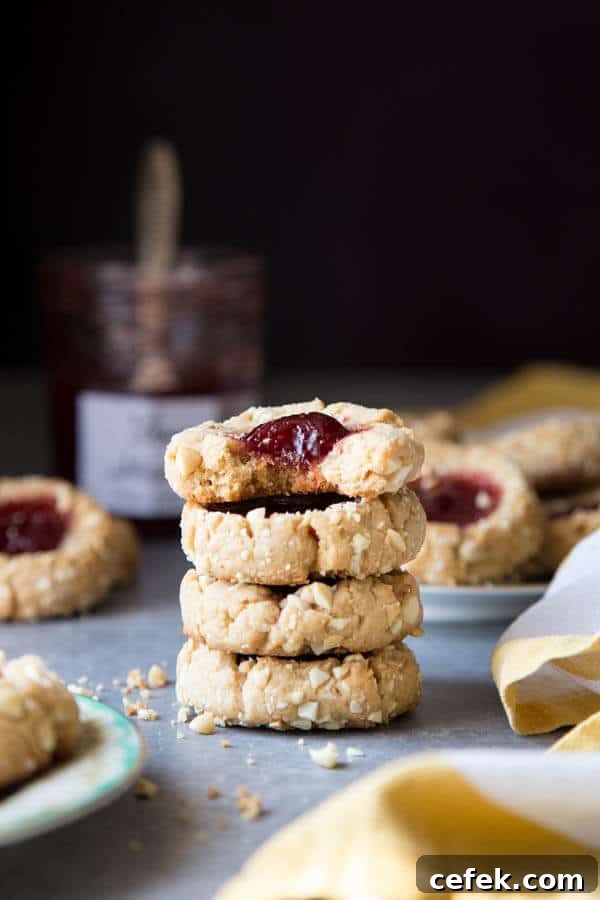 A stack of jam thumbprint cookies