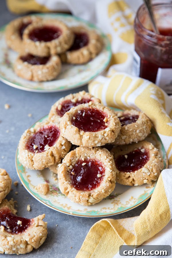 A plate of peanut butter and jam thumbprint cookies