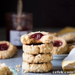 A stack of jam thumbprint cookies