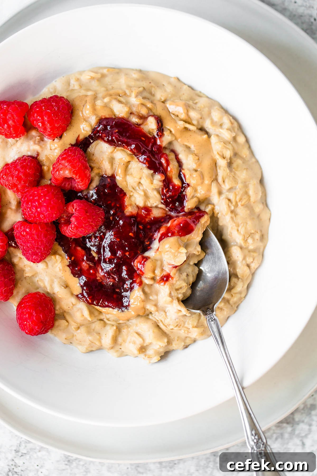 peanut butter and jelly oatmeal with raspberries on top