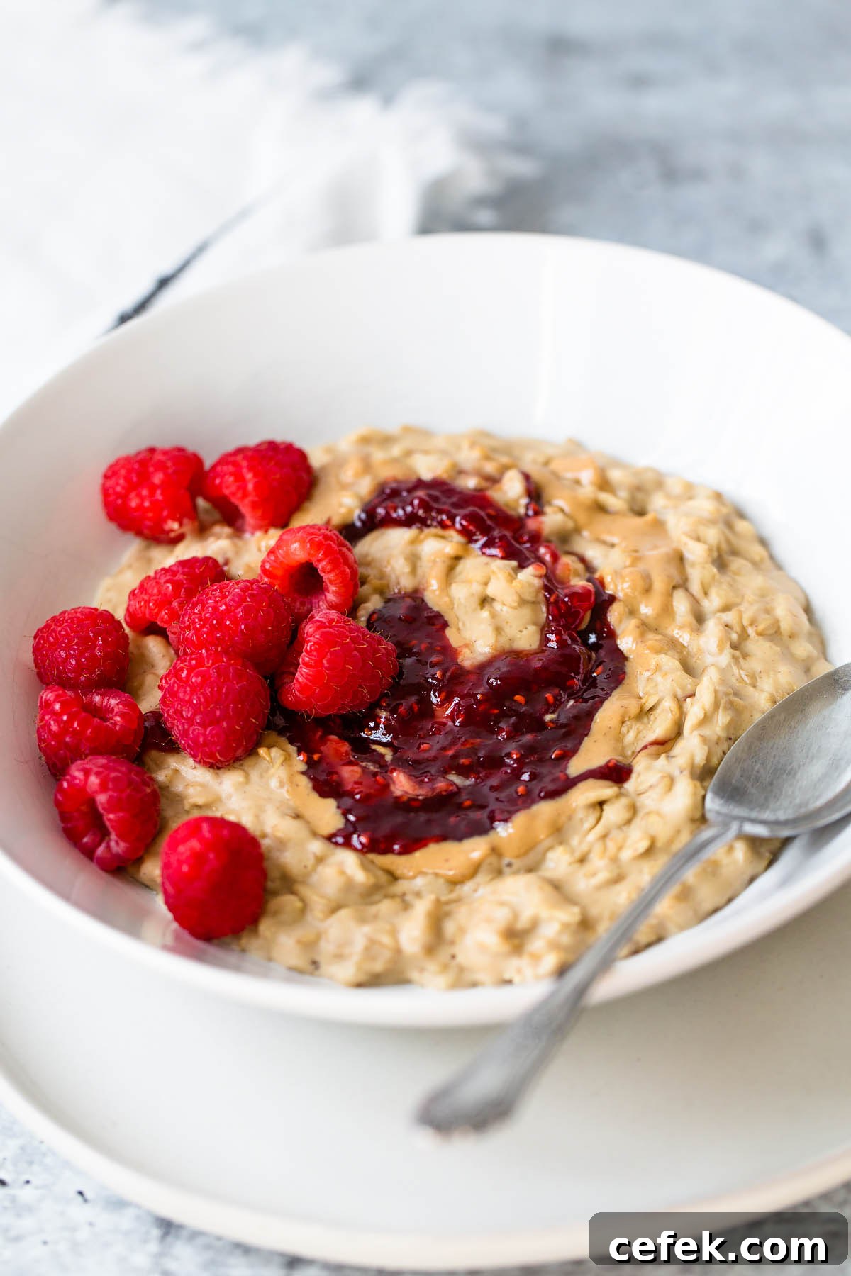 peanut butter and jelly oatmeal with raspberries on top
