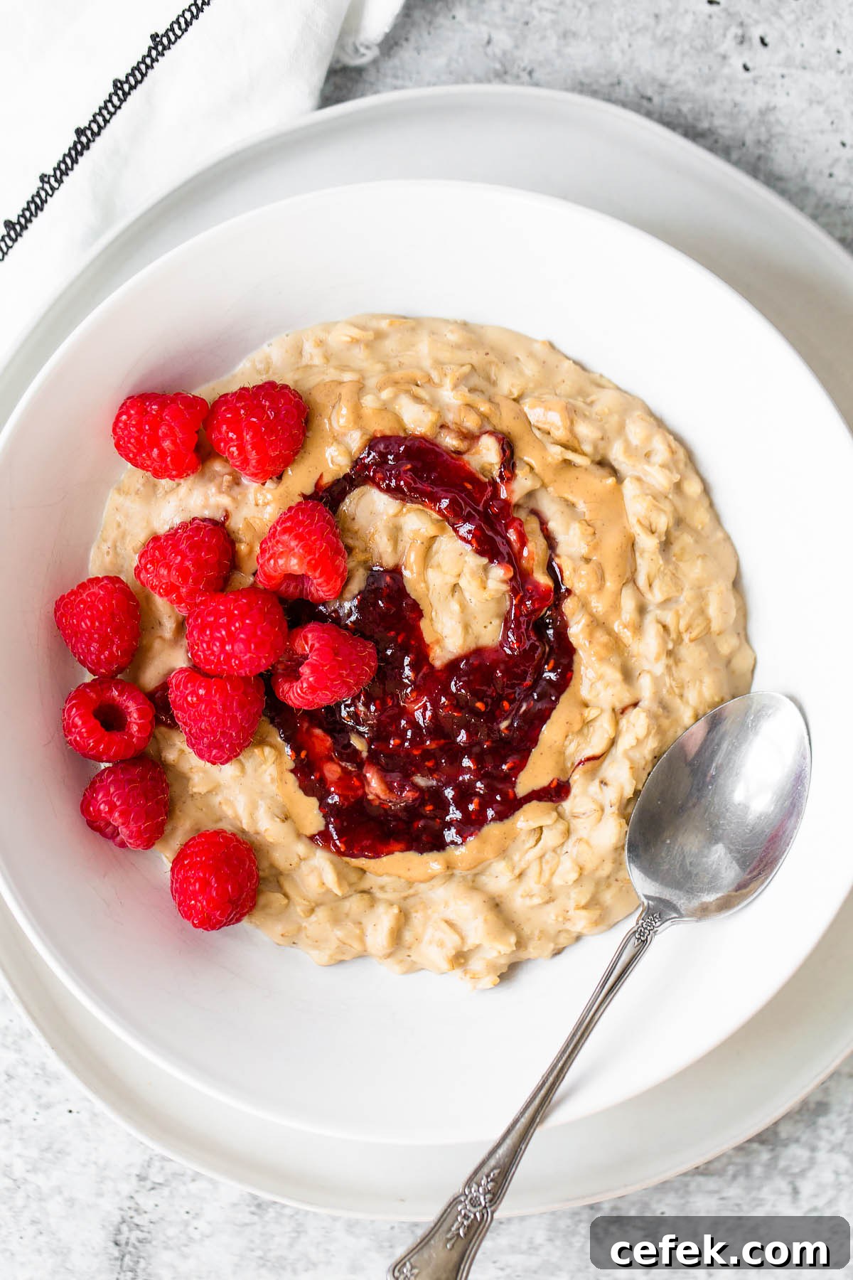 peanut butter and jelly oatmeal with raspberries on top