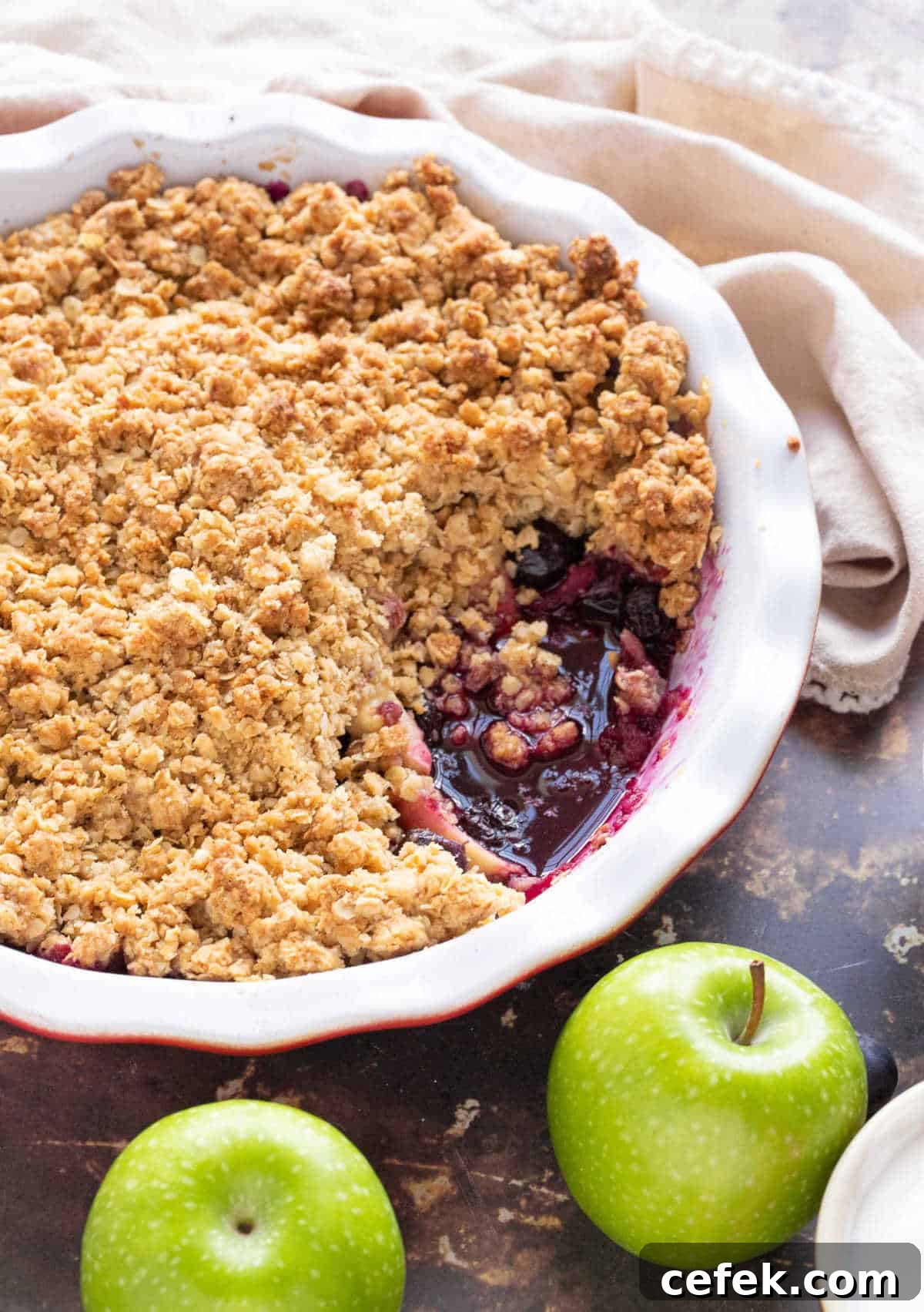 Apple and blueberry crumble in a pie dish.