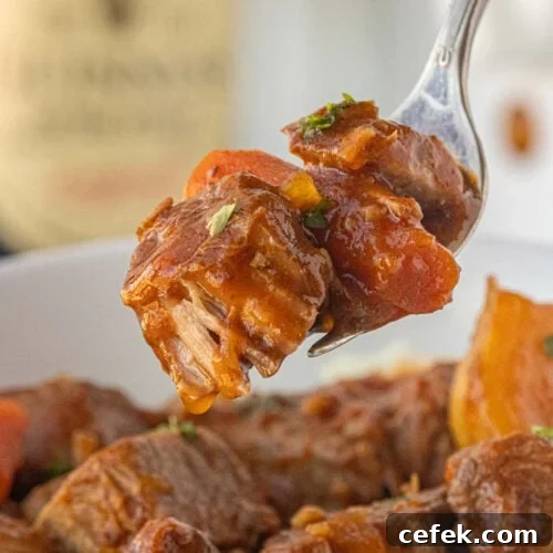 Crockpot Guinness beef stew finished and ready to serve in white slow cooker