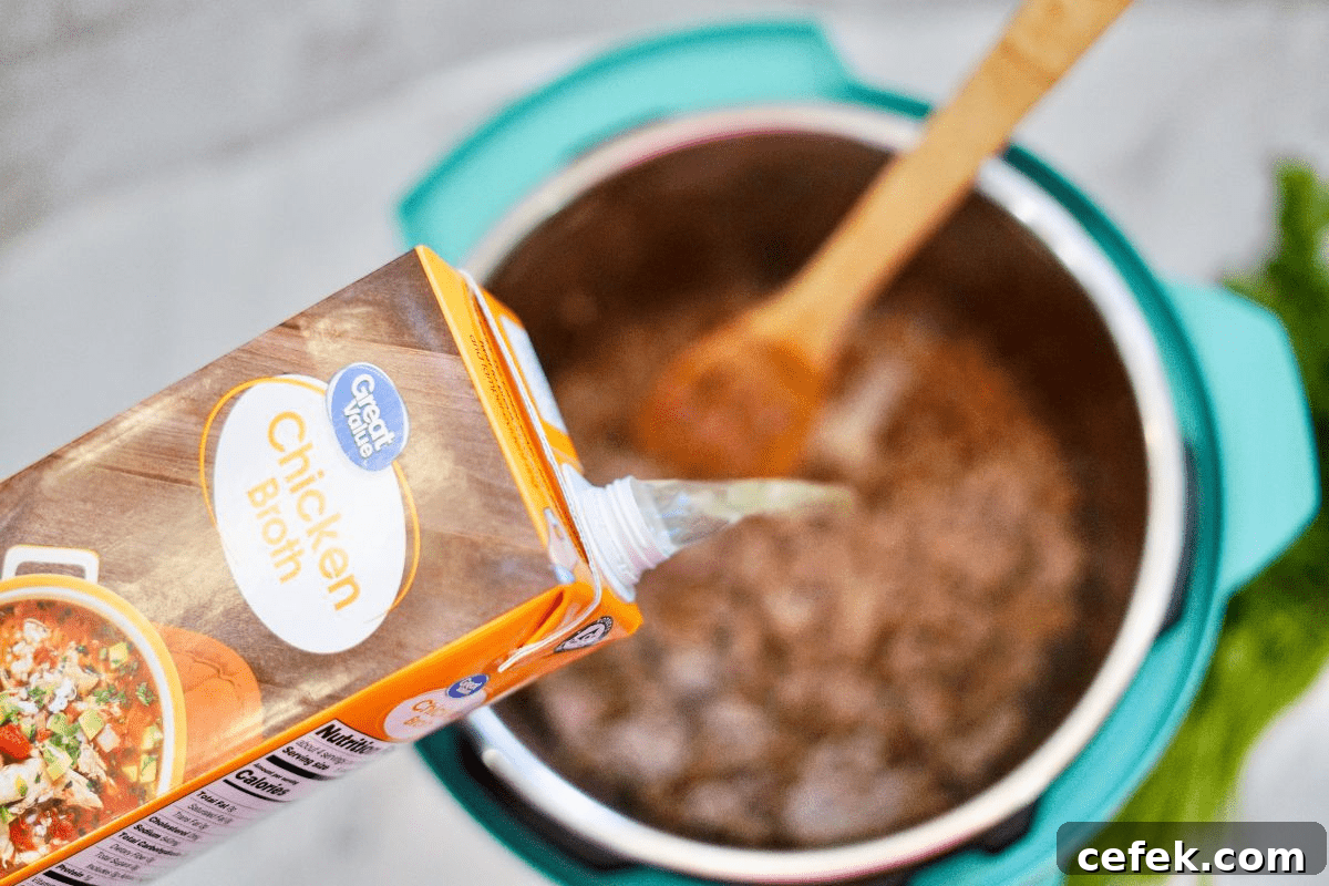 pouring broth into instant pot