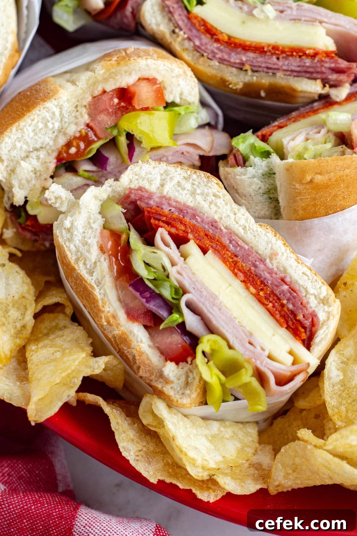 close up italian sub cut in half on a platter
