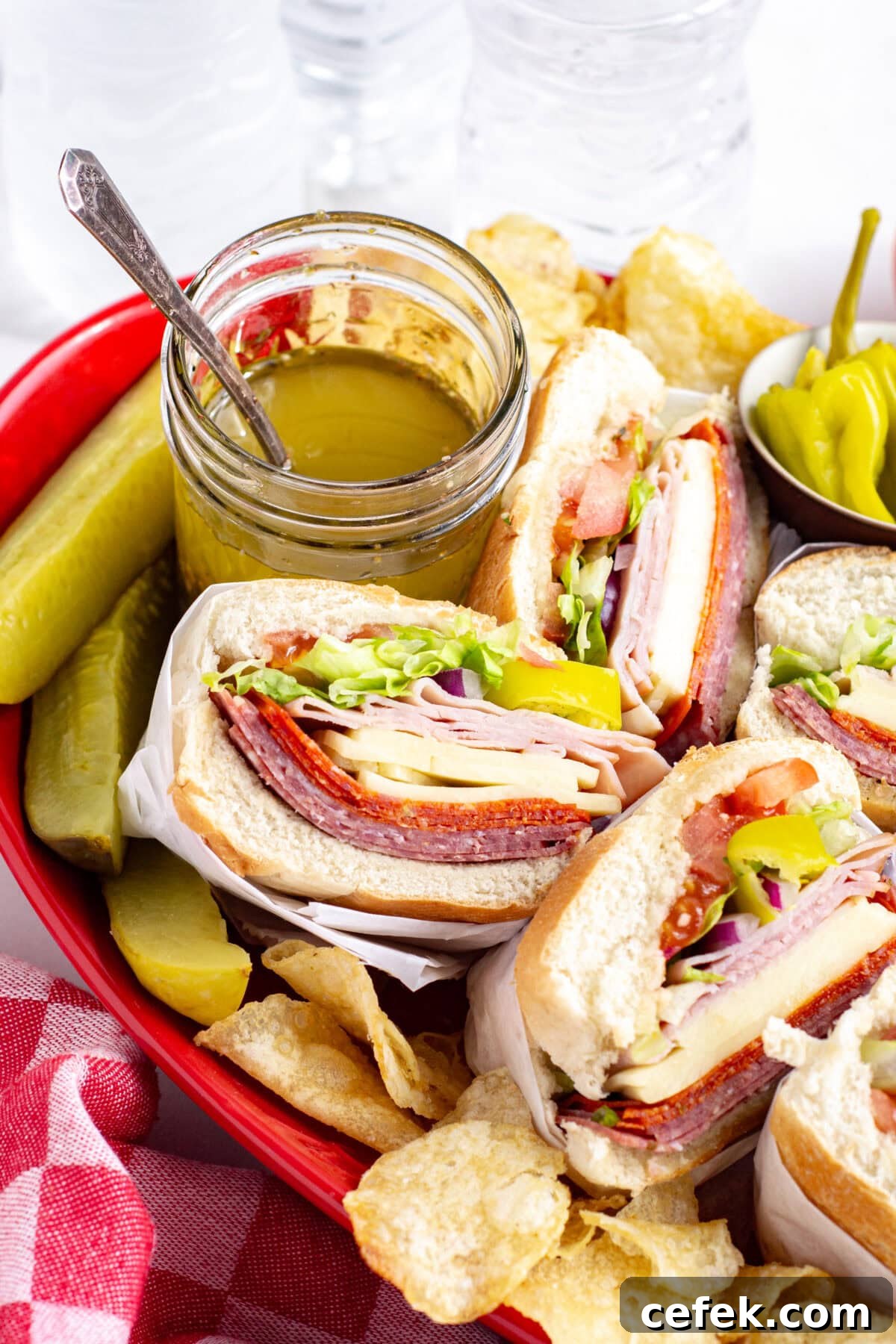platter of italian subs with red wine vinaigrette and pickles