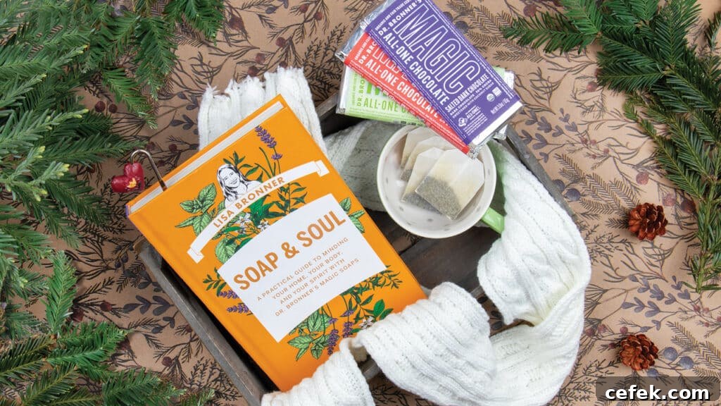 Soap & Soul book with tea, Dr. Bronner's Magic Chocolate and greenery.