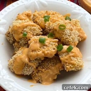 Healthy bang bang chicken that was baked in the oven in a bowl.