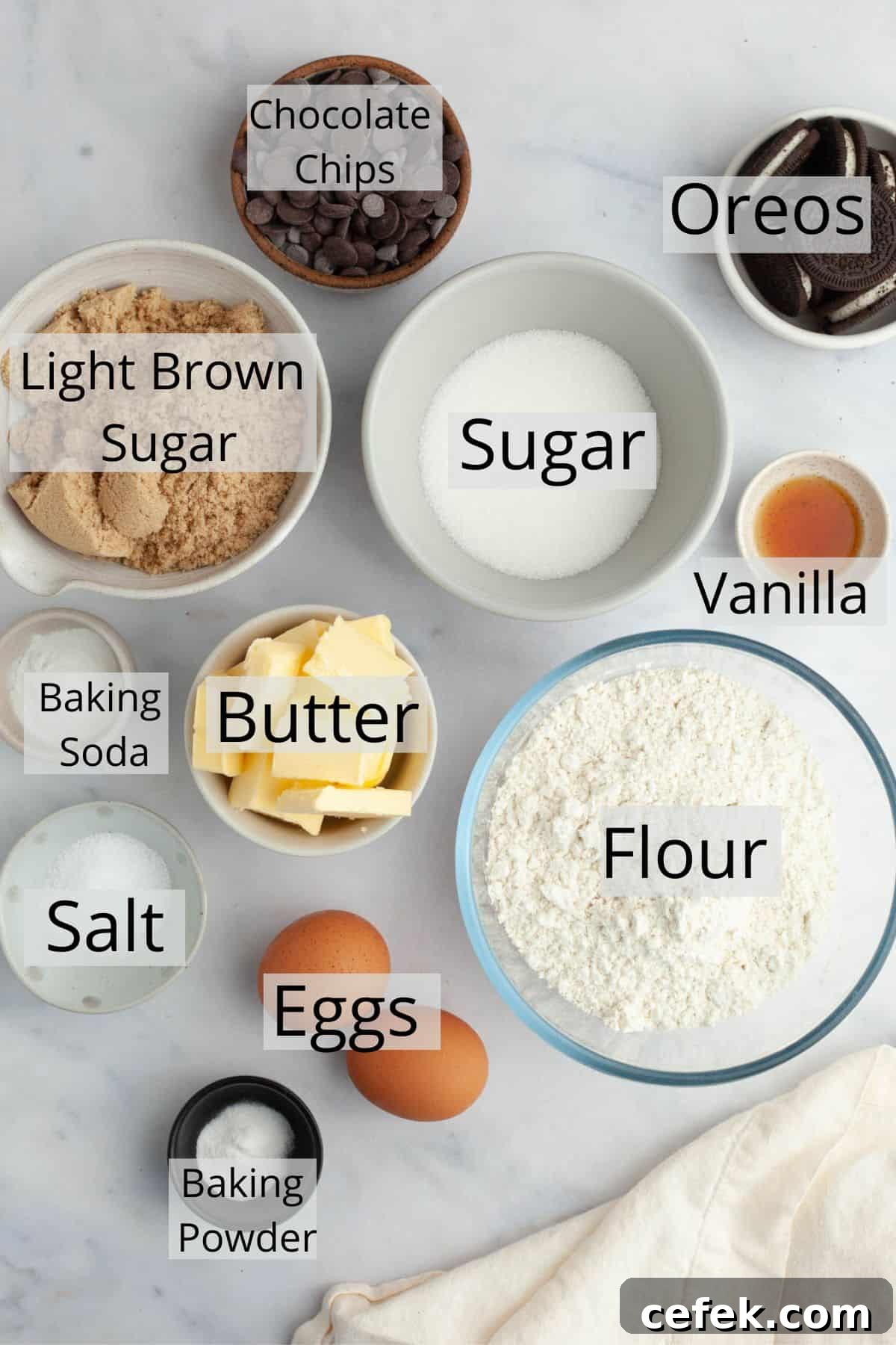All the ingredients needed for Oreo chocolate chip cookies weighed out into bowls.