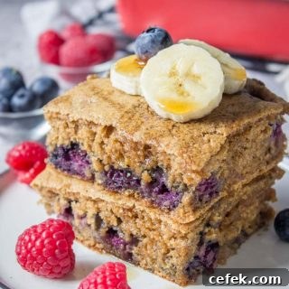 Healthy oven baked Blueberry Pancake Casserole topped with banana and raspberries