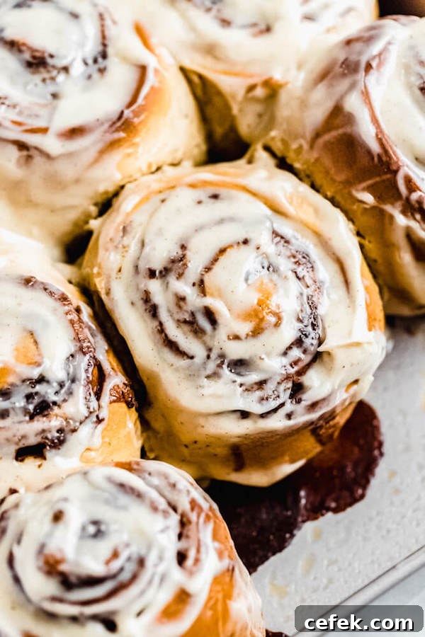 close up of chai cinnamon rolls in a square pan