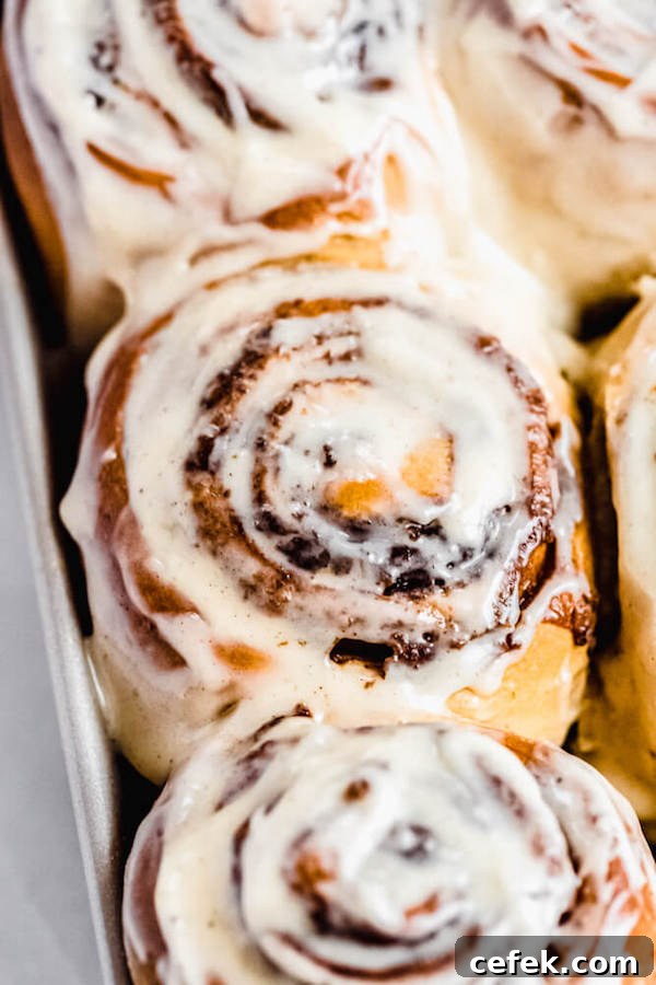 close up of frosted cinnamon rolls