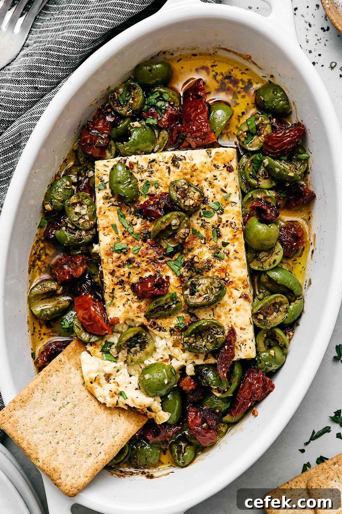 Christmas appetizers featuring a baked Mediterranean feta cheese.