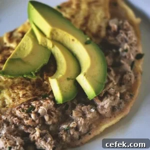 A crab omelet featuring avocado, served on a plate.