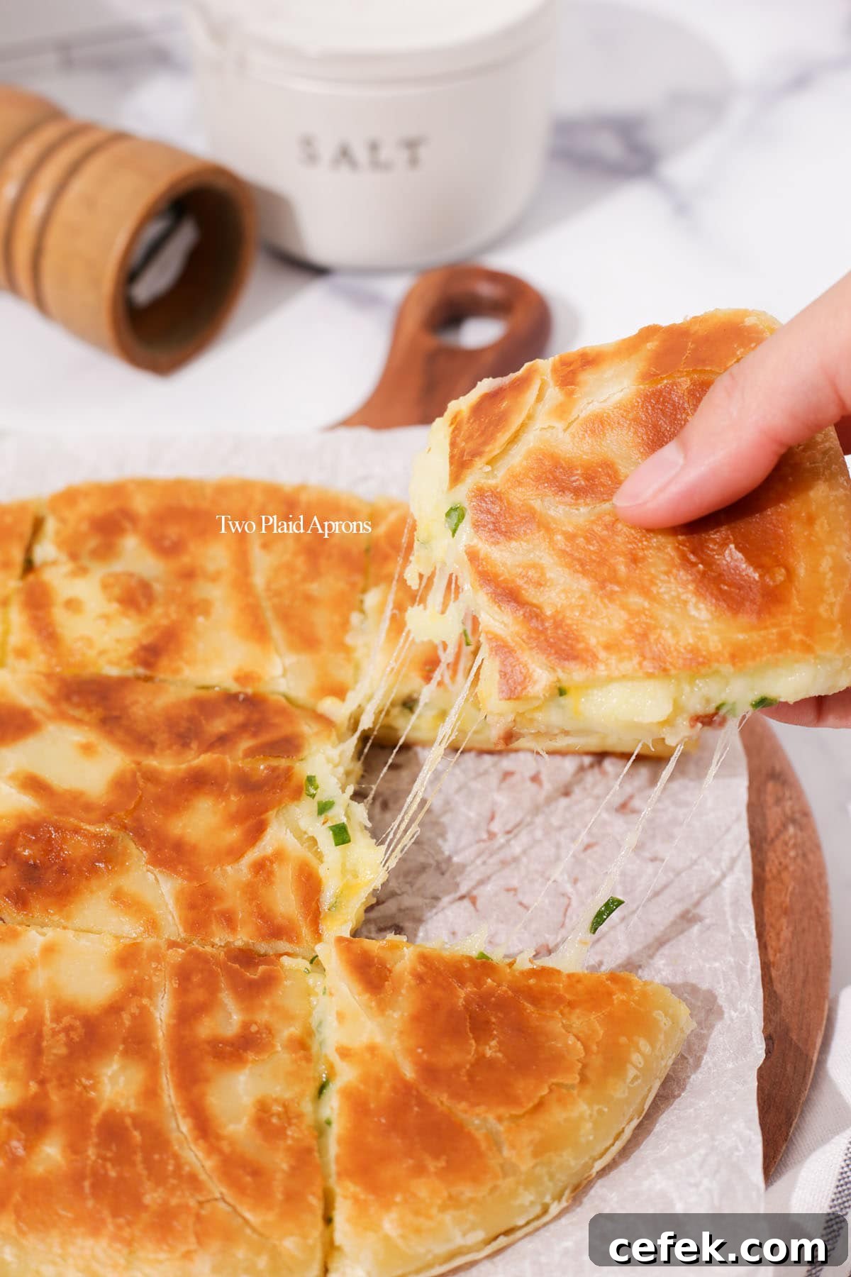 Cheese pull from the cheesy loaded potato bread.
