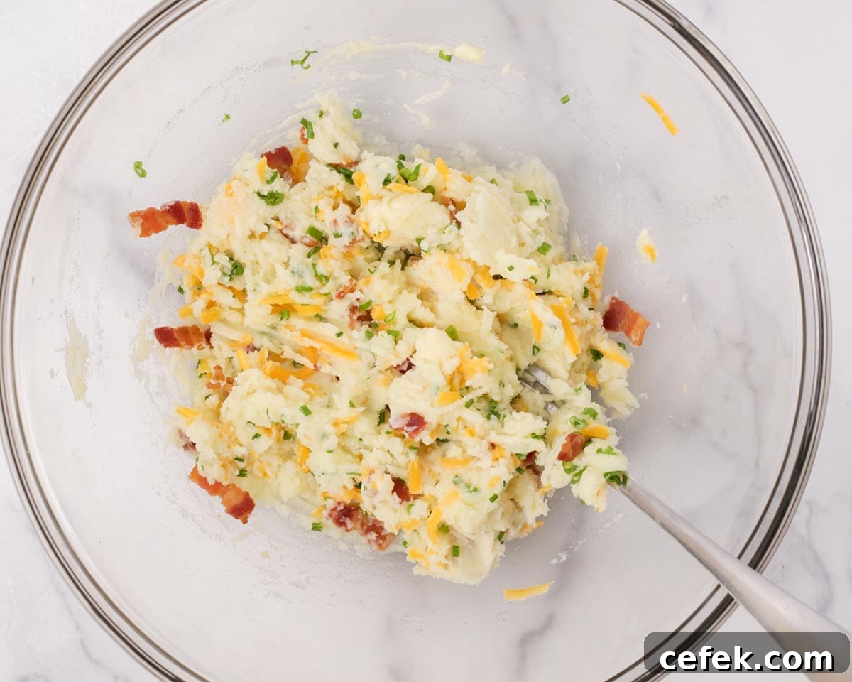 Loaded potato filling mixed in a bowl.