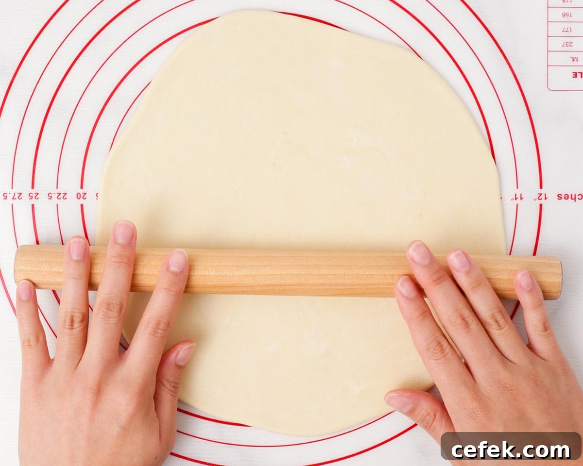 Rolling out the dough.