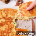 Cheese pull from the cheesy loaded potato bread thumbnail.